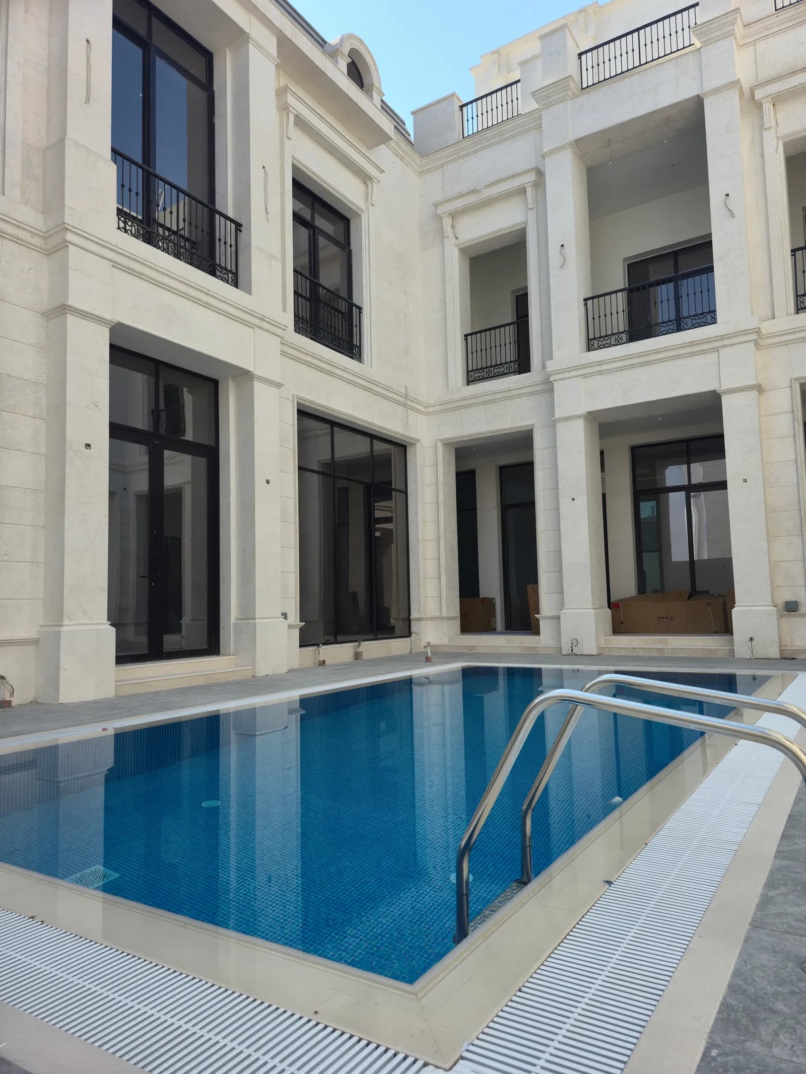 Courtyard elevations in natural Syrian stone at the Ain Khaled villa in Doha, supplied and fixed by Auckland